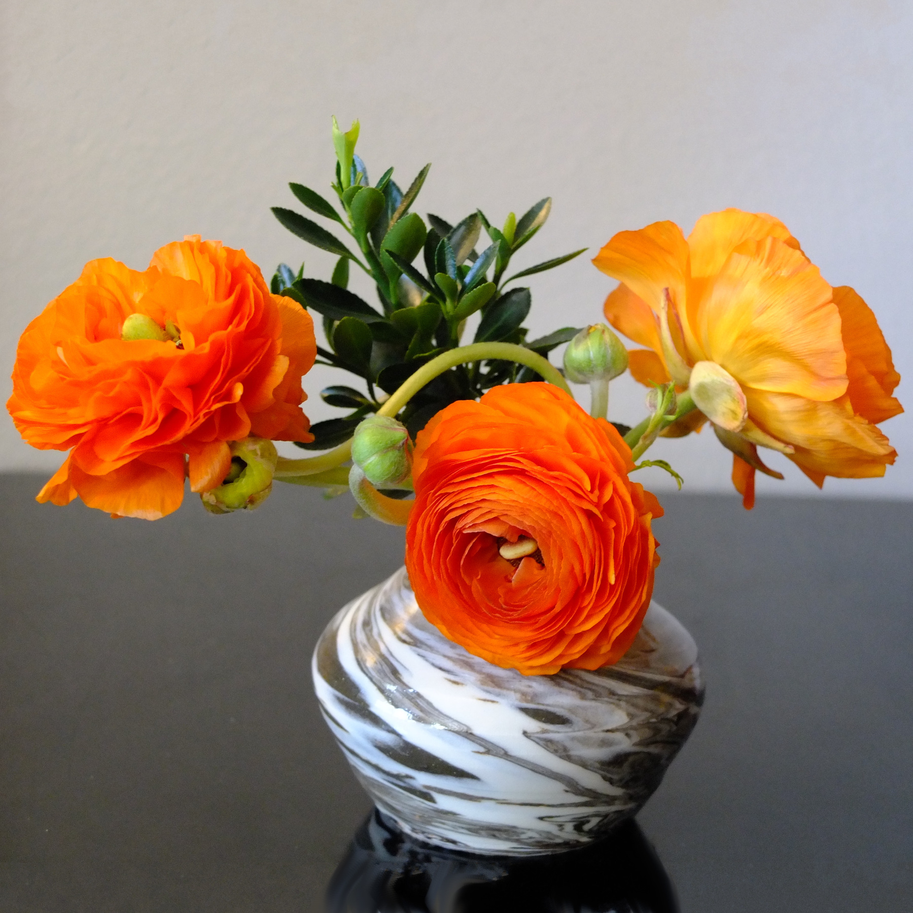 Orange ranunculus arrangement by BWS Johnson